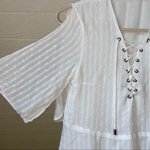White flowy lace up top.